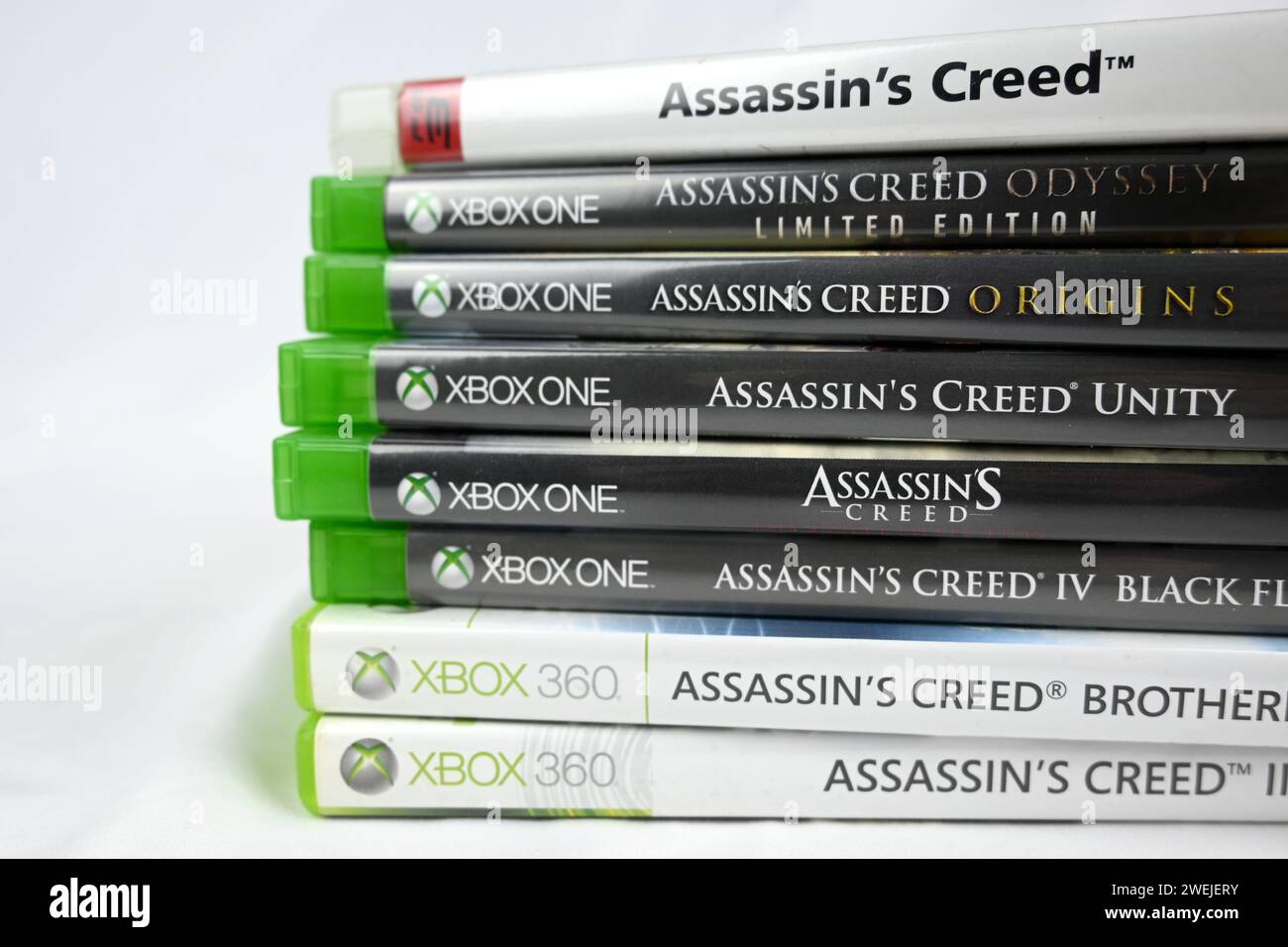 Assassin’s Creed video games stacked pile  – Wales, UK  –  25 January 2024 Stock Photo