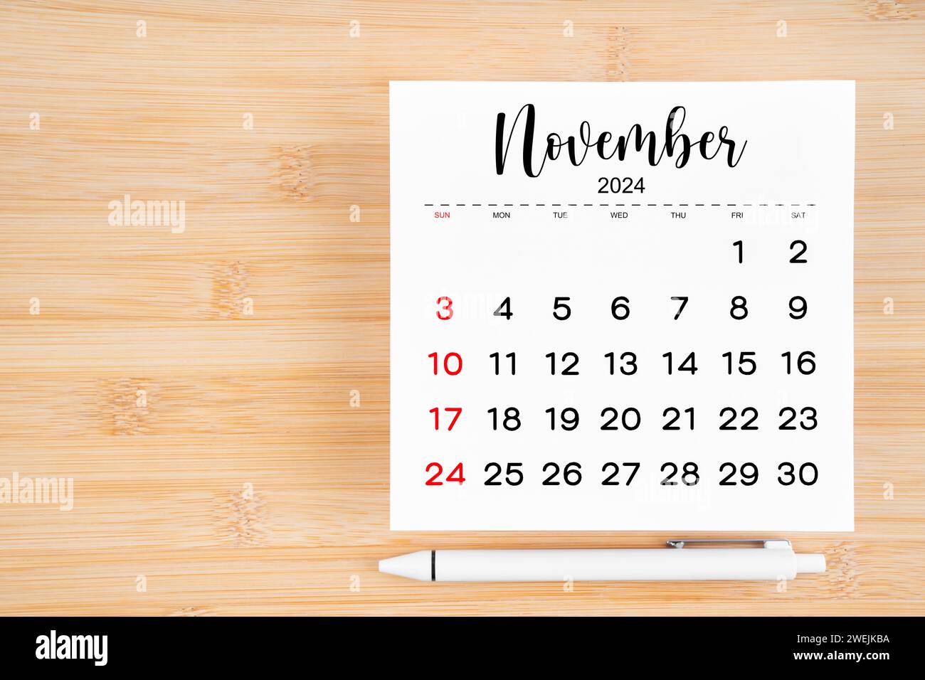 november-2024-calendar-on-wooden-desk-and-alarm-clock-with-customizable-space-for-text-monthly-calendar-concept-and-copy-space-stock-photo-alamy