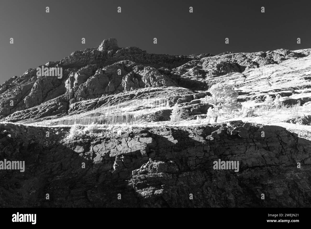 Monochromatic image of Glacier National Park in Infra Red with a fully converted camera showing a unique perspective of this incredible Park in Montan Stock Photo