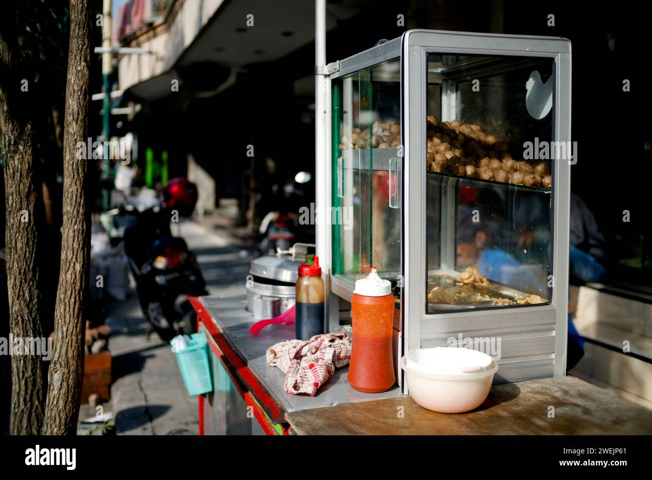 Hawker street food in the city. Street food cart called pentol or bakso