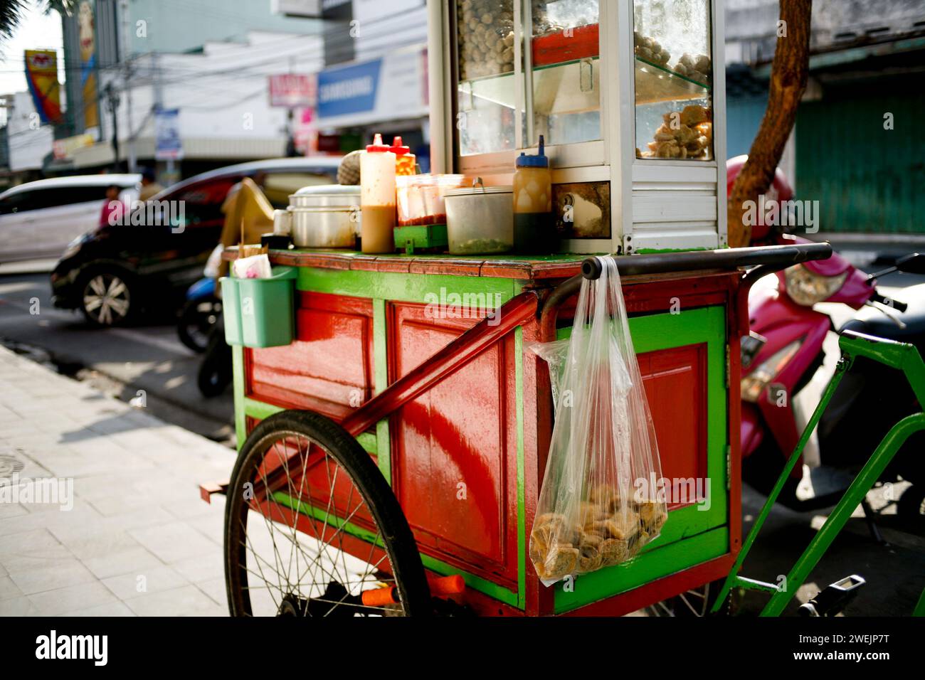Hawker street food in the city. Street food cart called pentol or bakso