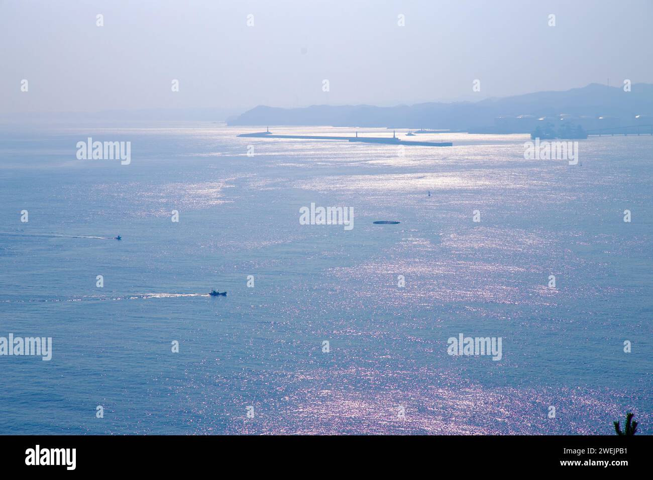 Samcheok City, South Korea - December 28, 2023: A 4k video capturing an expansive view of the East Sea from Lady Suro Memorial Park on a misty day, fe Stock Photo