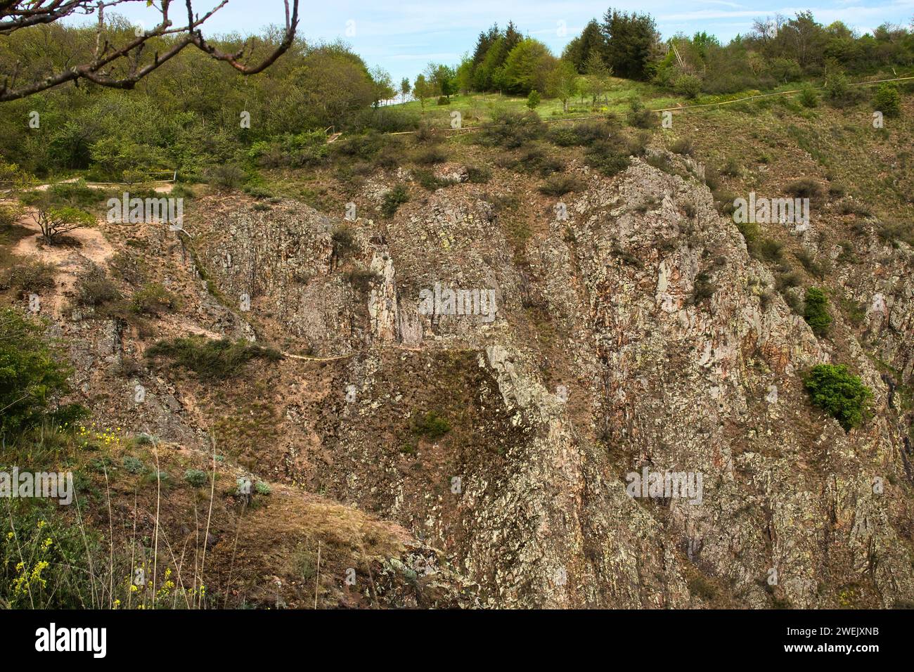 Walking path on the edge of a cliff at Rotenfels on a spring day in Germany. Stock Photo