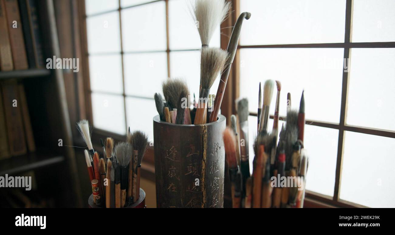Paint brush, equipment and supplies in empty studio closeup for art, creative or talent showcase. Workshop interior or room with still life objects Stock Photo