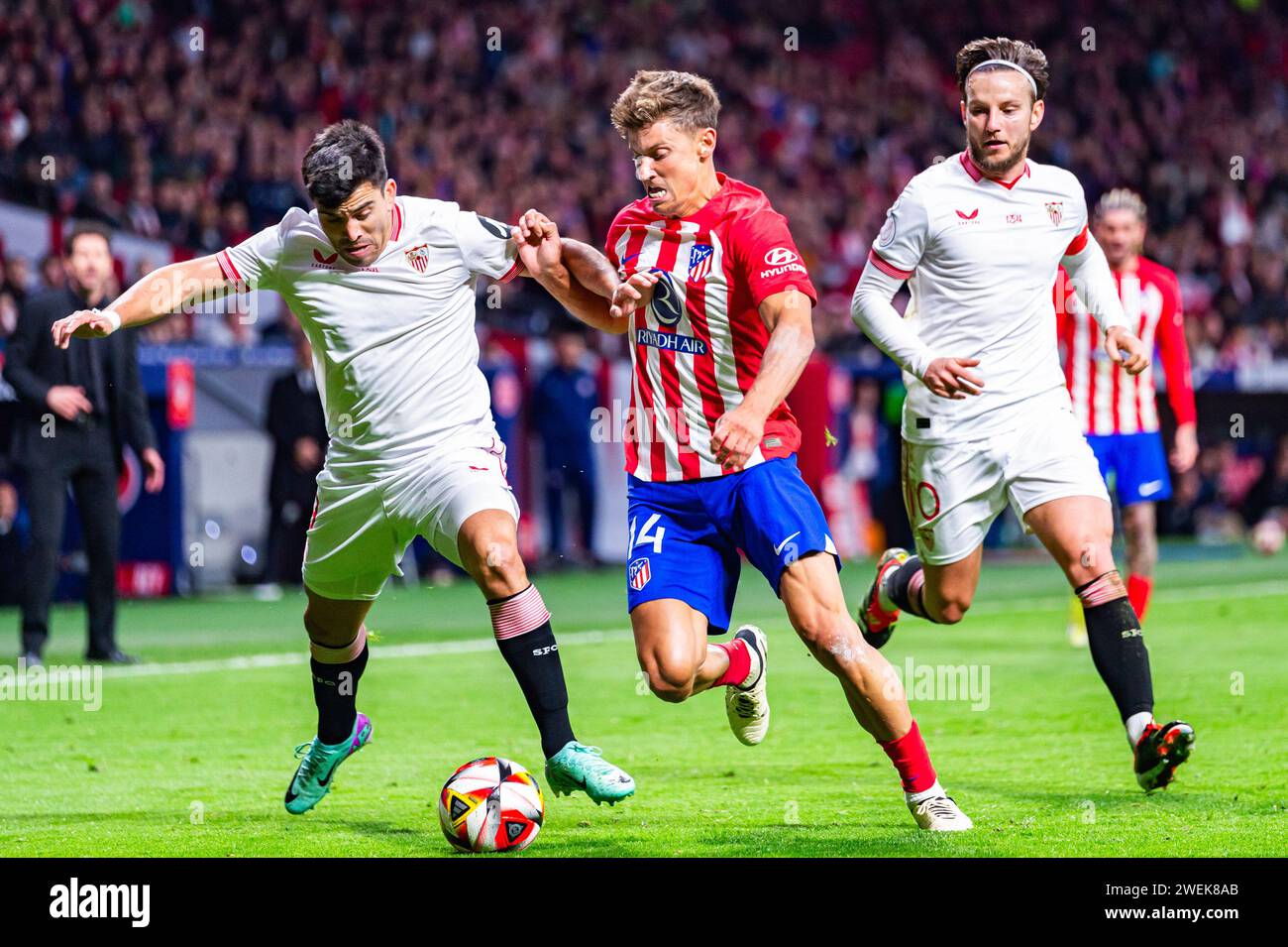 Madrid, Spain. 25th Jan, 2024. Marcos Llorente (C) of Atletico Madrid, Marcos Acuna (L) and Ivan Rakitic (R) of Sevilla in action during the football match valid for quarter finals of the Copa del Rey tournament between Atletico Madrid and Sevilla played at Estadio Metropolitano. Atletico Madrid 1 : 0 Sevilla Credit: SOPA Images Limited/Alamy Live News Stock Photo