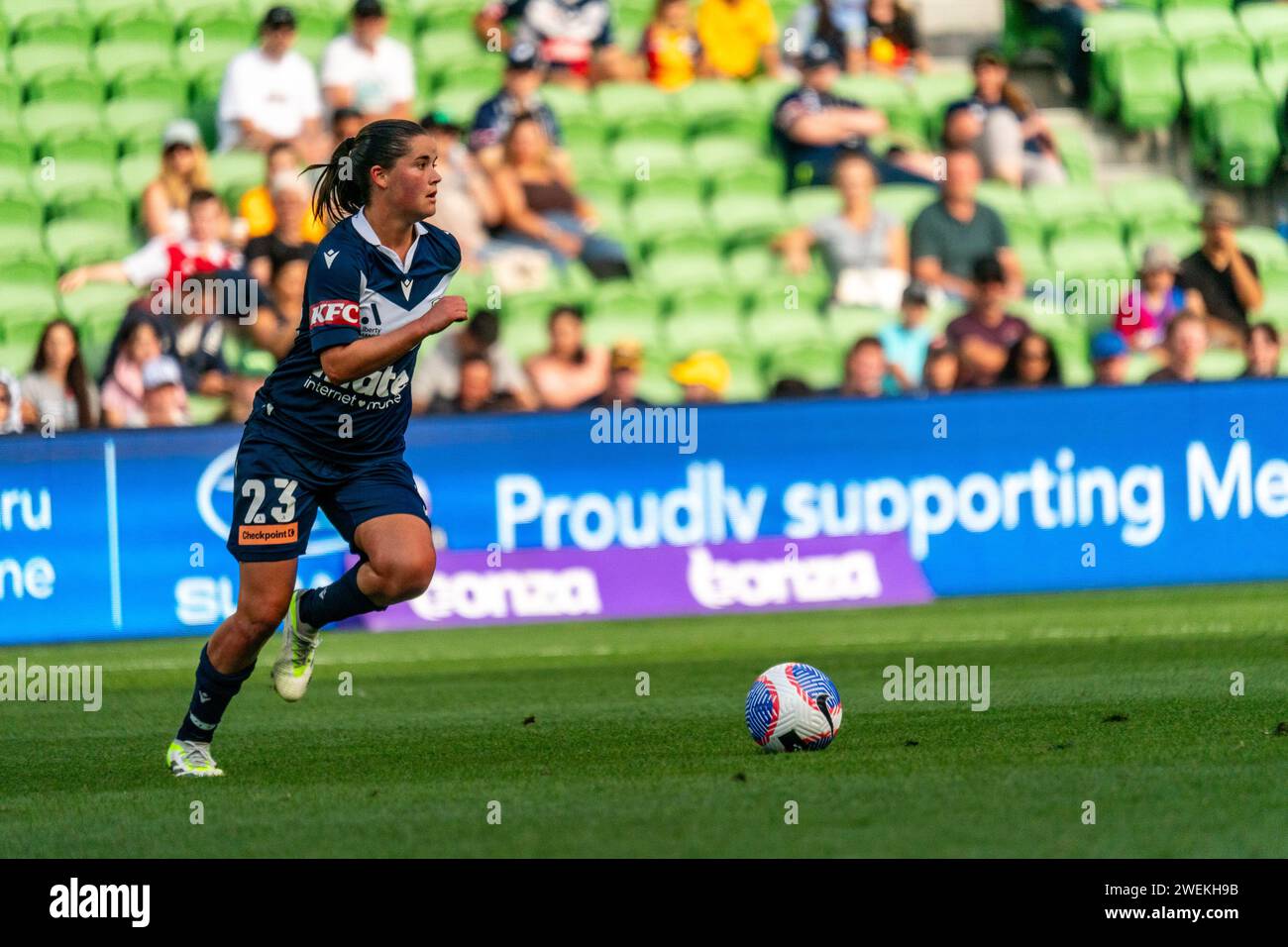 Melbourne, Australia. 26 January, 2024. Melbourne Victory FC Midfielder Rachel Lowe (#23) runs the ball across the field looking for a pass during the Liberty A-League Women’s match between Melbourne Victory FC and Sydney FC at AAMI Park in Melbourne, Australia. Credit: James Forrester/Alamy Live News Stock Photo