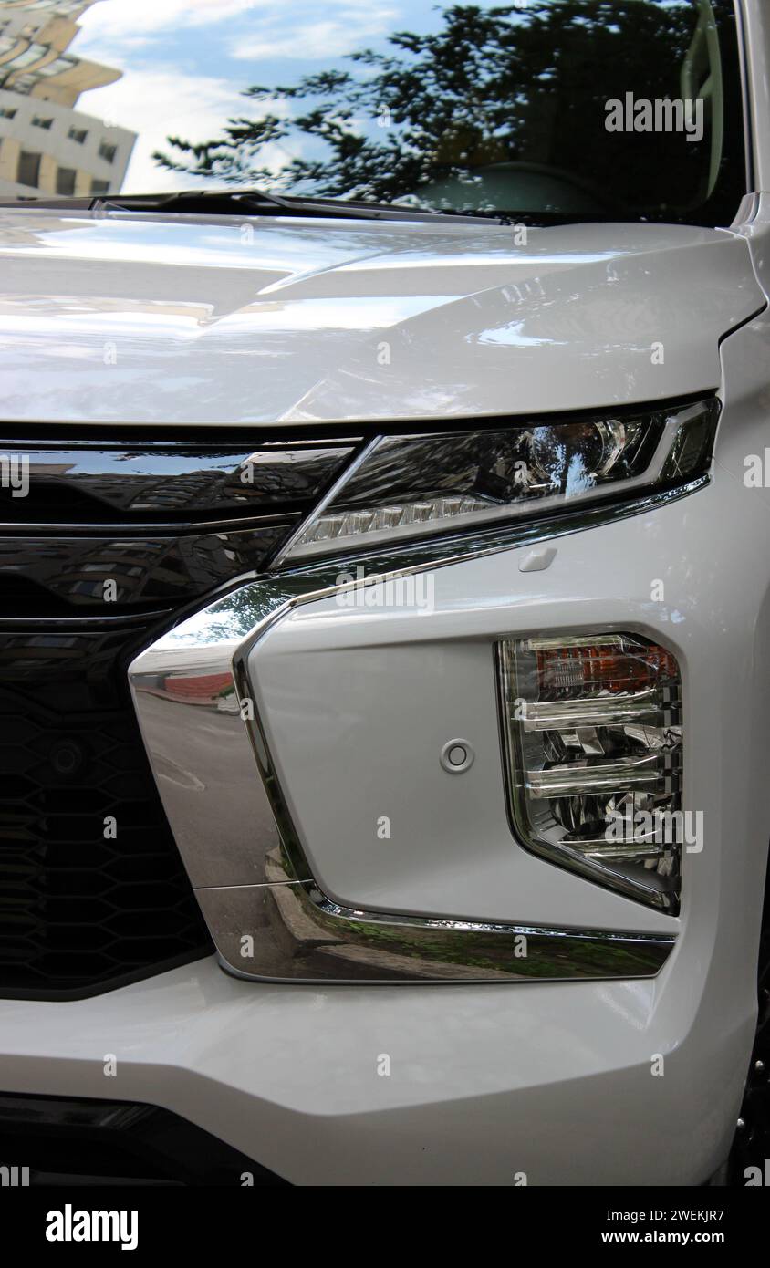Chrome elements around the LED headlight units on the front bumper of the car Stock Photo