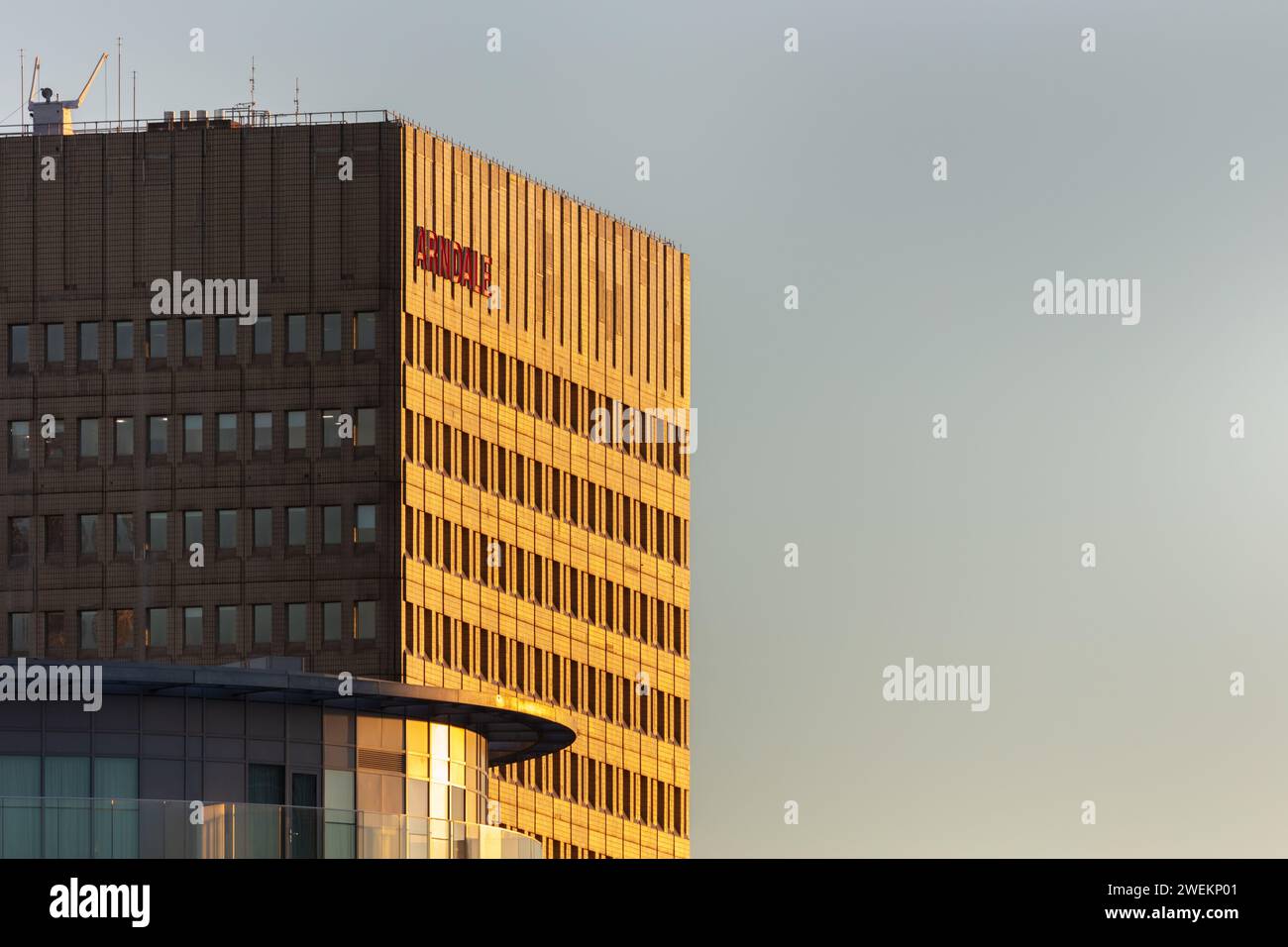 An image of the higher levels of the iconic Arndale House, Manchester, UK taken at golden hour Stock Photo