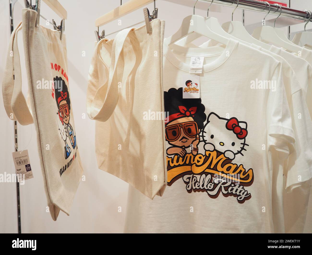 TOKYO, JAPAN - January 26, 2024: T-shirts and bags in a Hello Kitty x Bruno Mars pop-up store. Focus is on the bag. The store is in Shibuya. Stock Photo