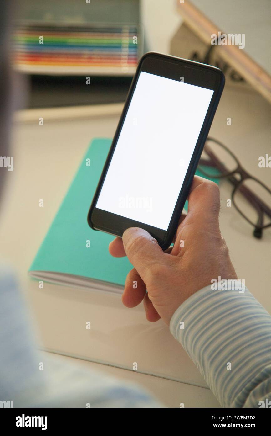 Man Holding White Blank Screen Smartphone Stock Photo