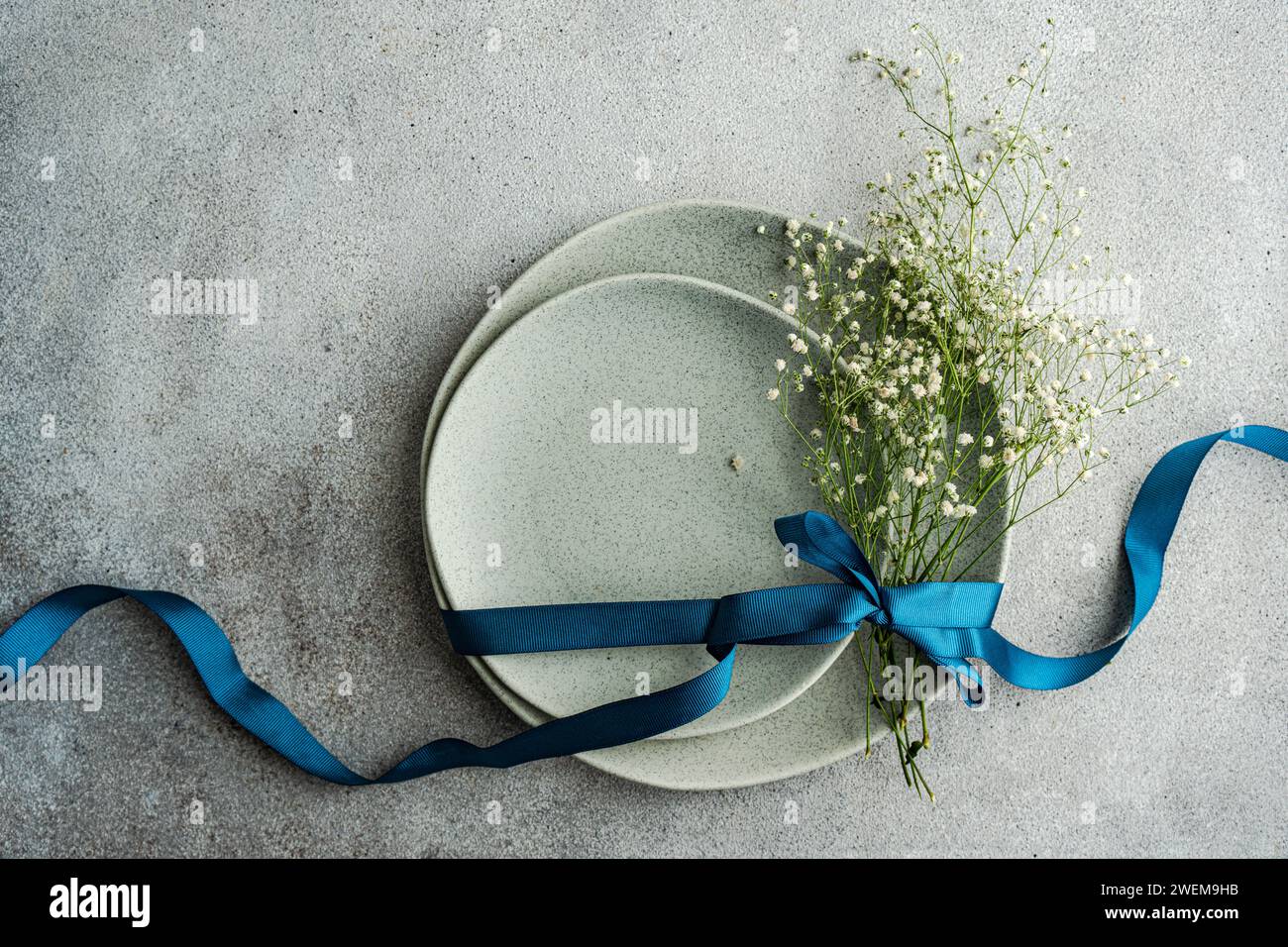 Table setting with fresh Gypsophila flowers Stock Photo