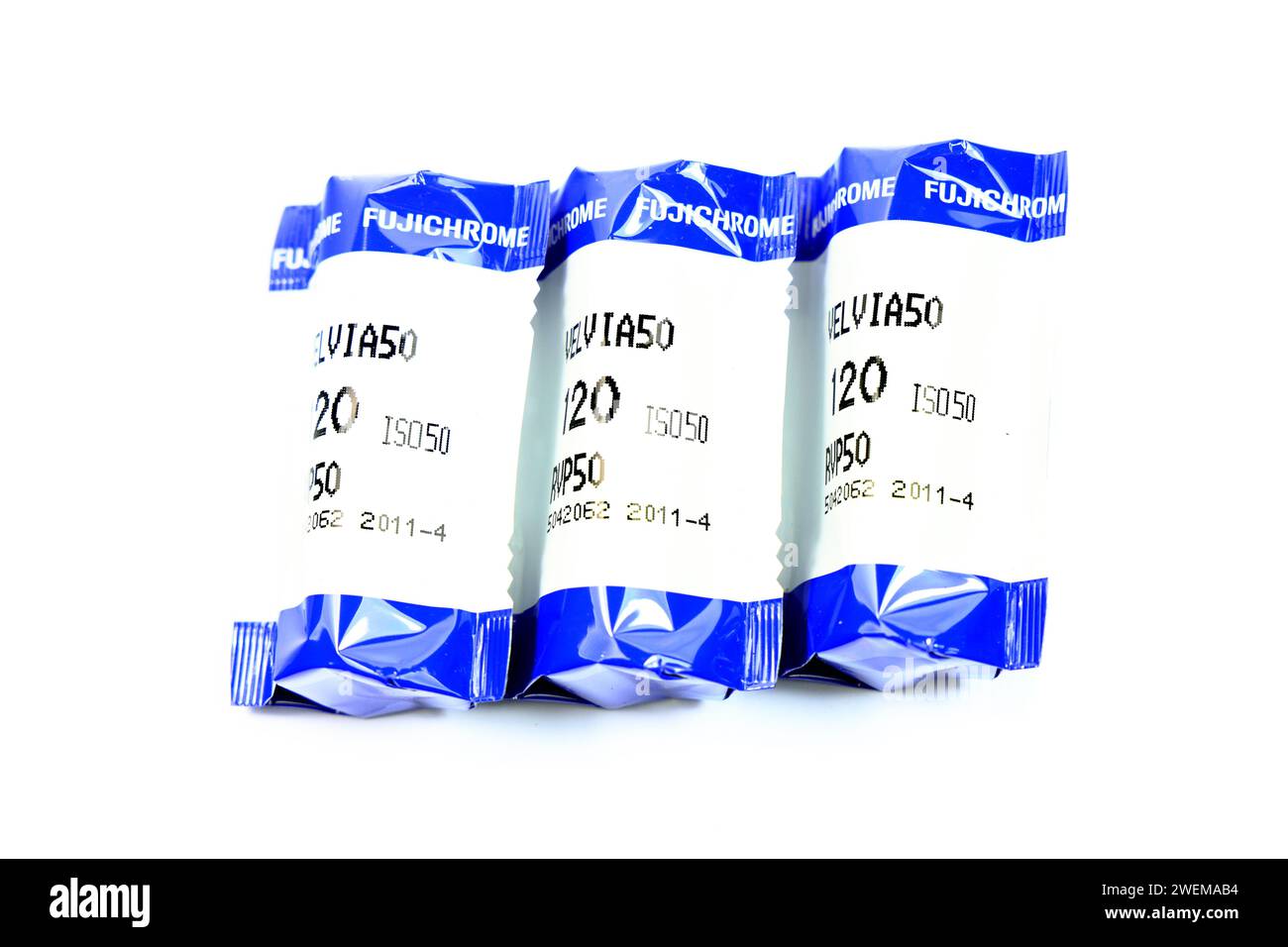 Three rolls of 120 Fujichrome Velvia film. Stock Photo