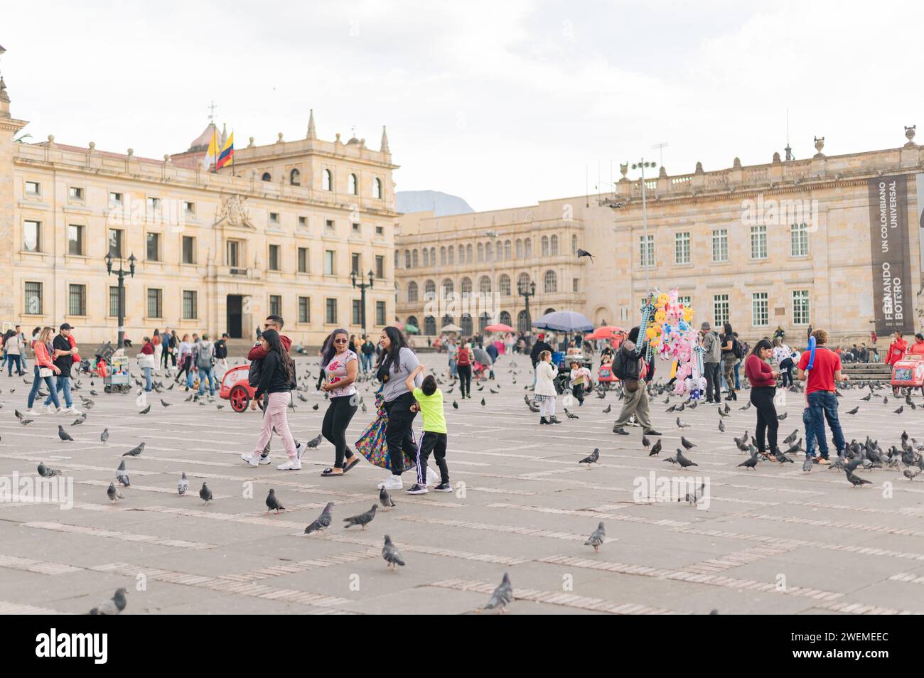 a day in the church square with people, pigeons and sales Stock Photo