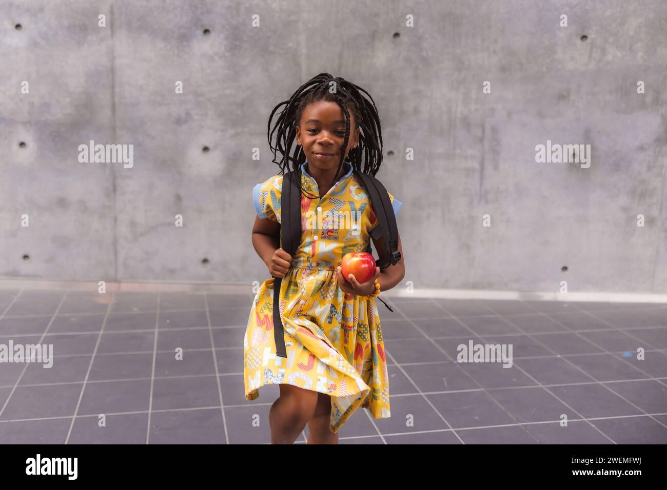 African American girl late for class Stock Photo