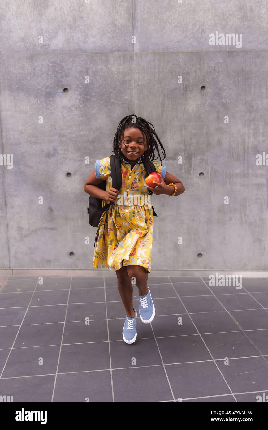 African American girl late for class Stock Photo