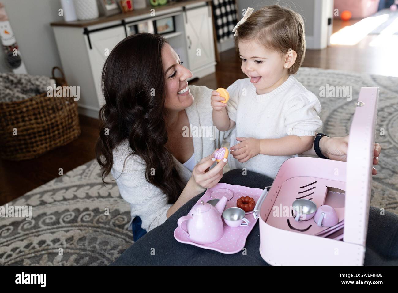 Girl playing tea party set hi-res stock photography and images - Alamy