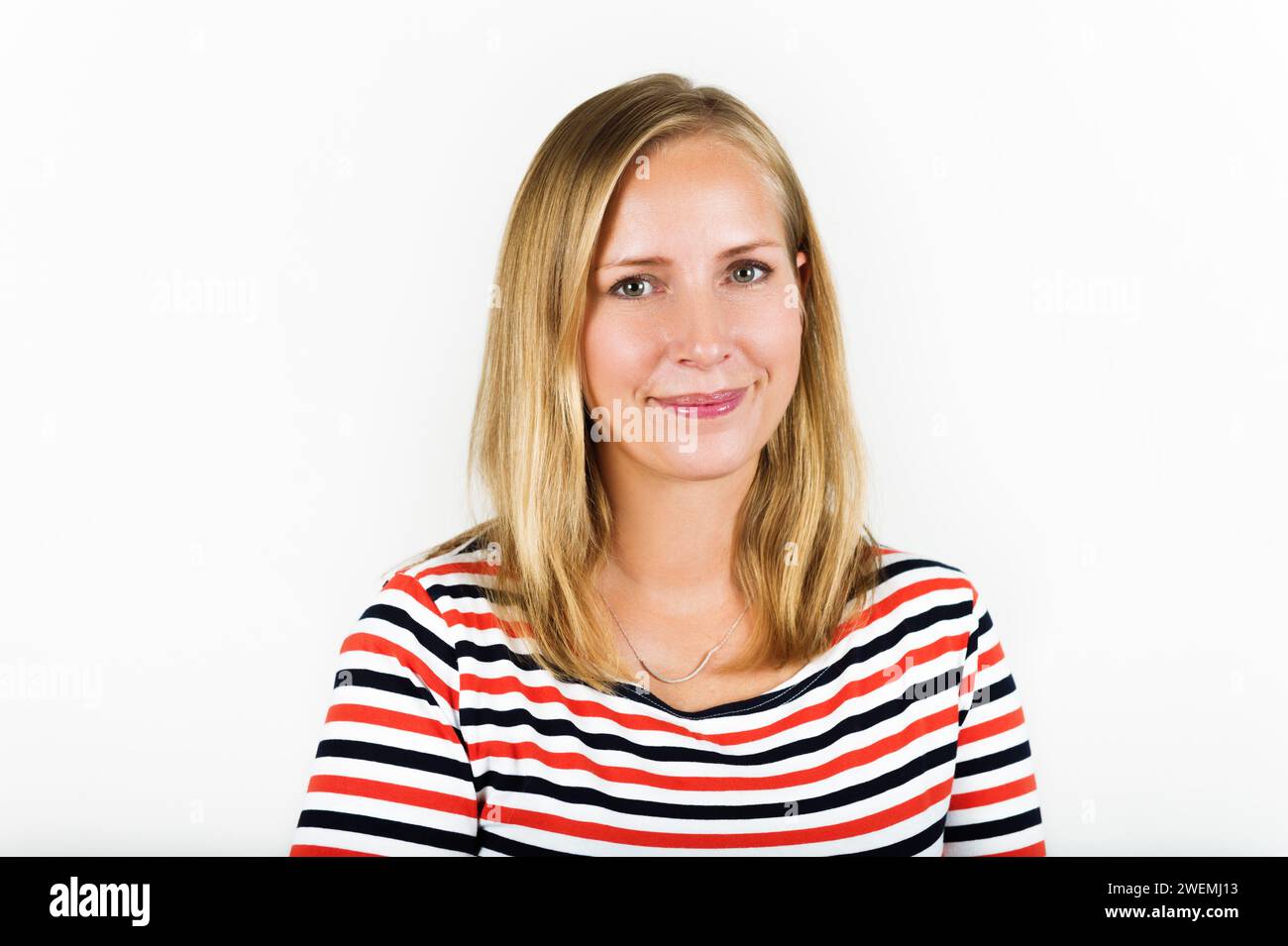 Studio shot of young blond woman wearing stripes t-shirt Stock Photo