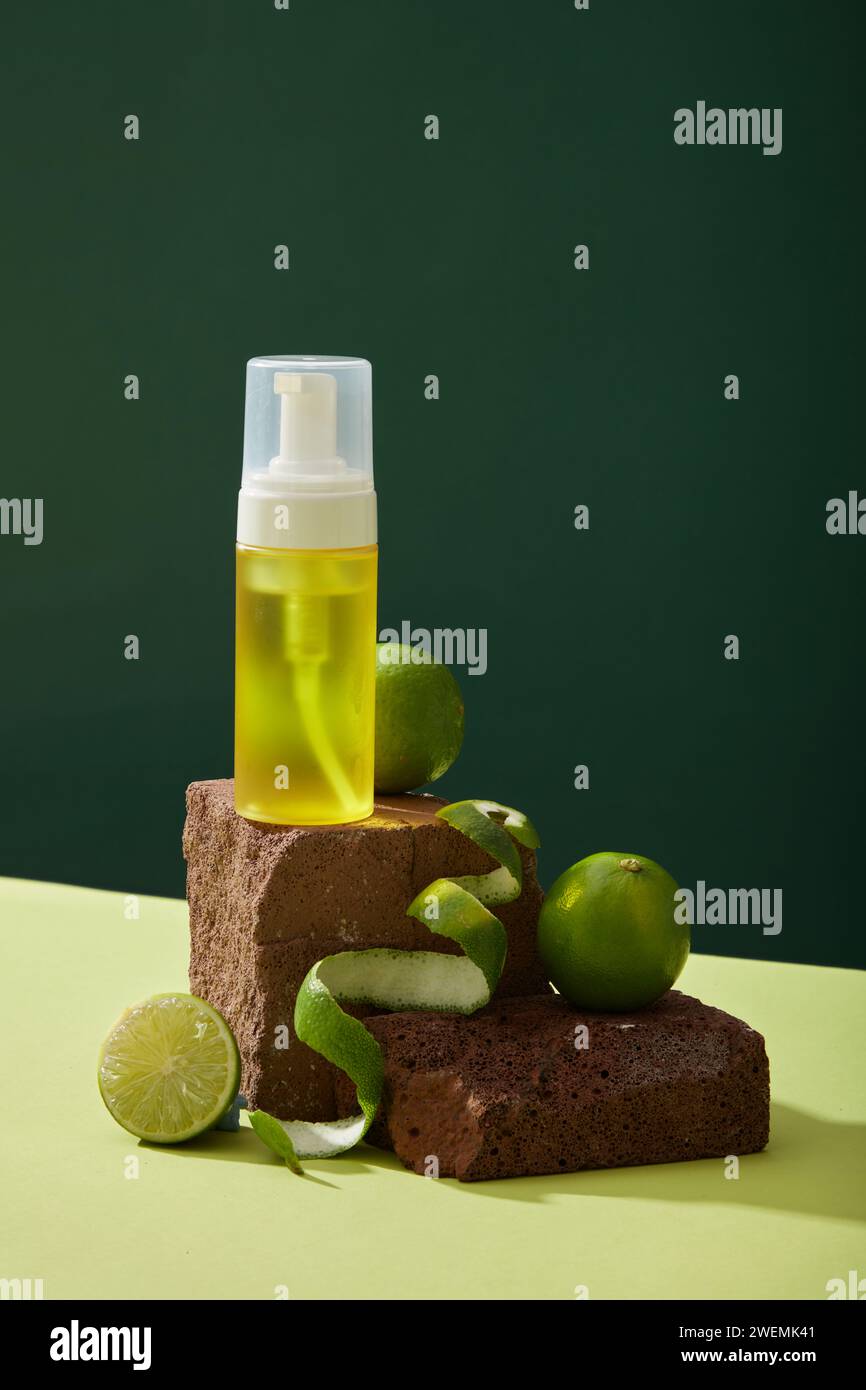 Front view of yellow spray bottle unlabeled placed on brown stone