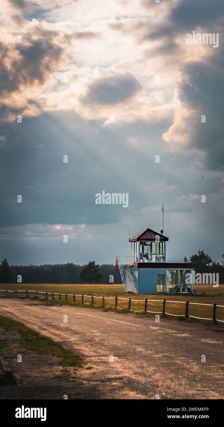 Lonely building under godrays Stock Photo
