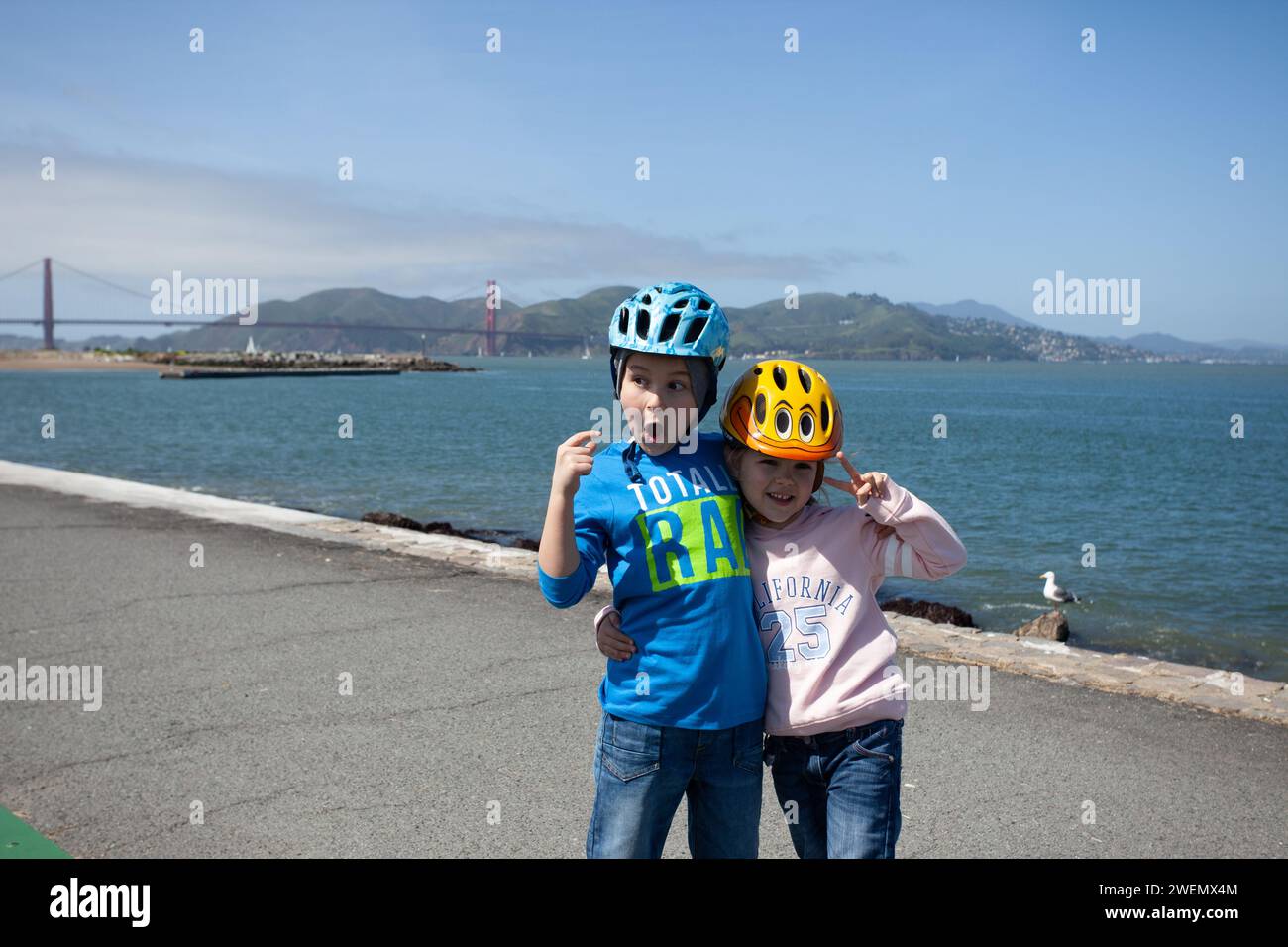 A young boy and young girl surprised by the Golden Gate Bridge in San