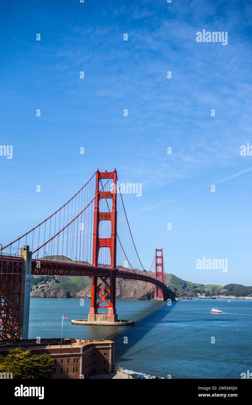 The Golden Gate Bridge is a suspension bridge spanning the Golden Gate, the one-mile-wide strait connecting San Francisco Bay, and the Pacific. Stock Photo