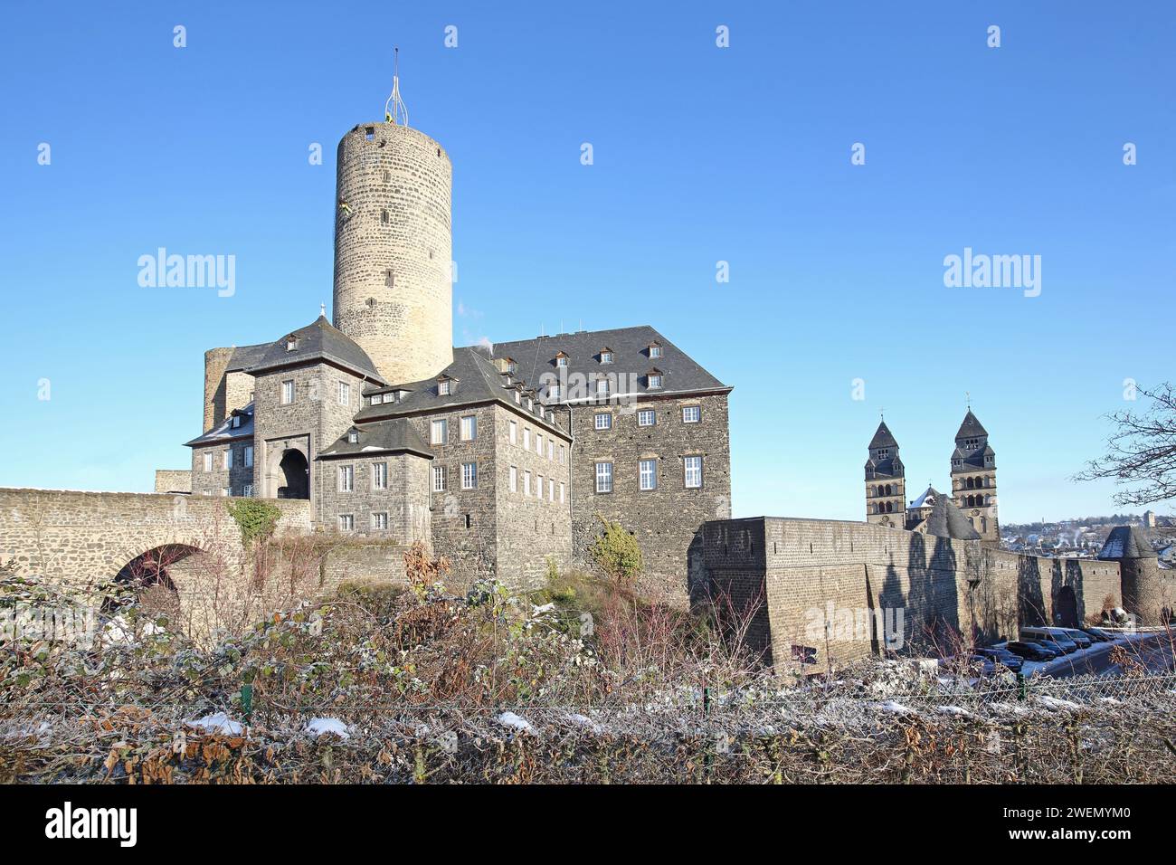 Genoveva Castle built in the 13th century with keep Goloturm, neo-Romanesque Herz-Jesu-Kirche built in 1911 with twin towers and historic town Stock Photo