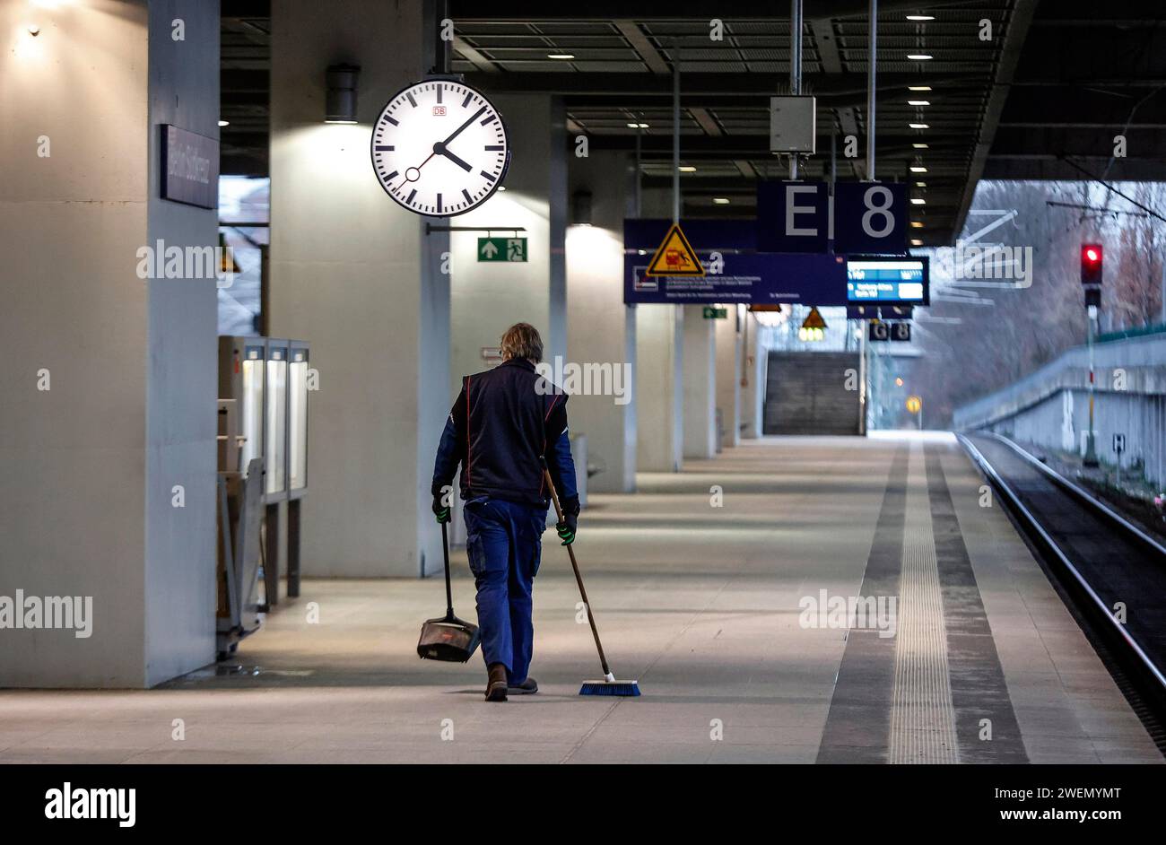 A Deutsche Bahn service employee cleans the platform at Suedkreuz ...