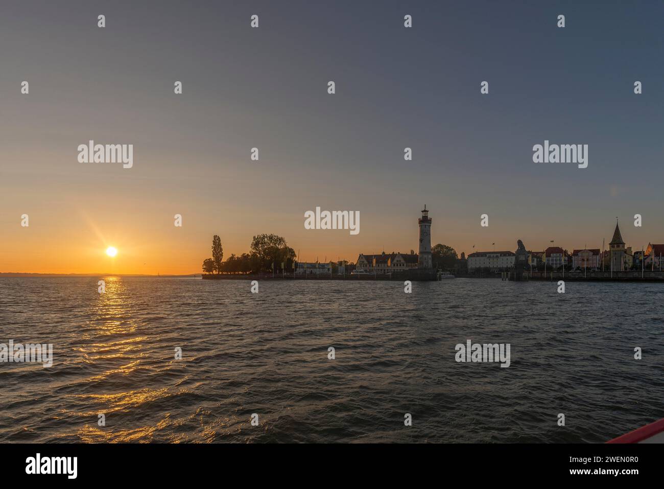 Lindau at Lake Constance, townscape, new lighthouse, entrance to the harbour, evening sun, Bavaria, Germany Stock Photo