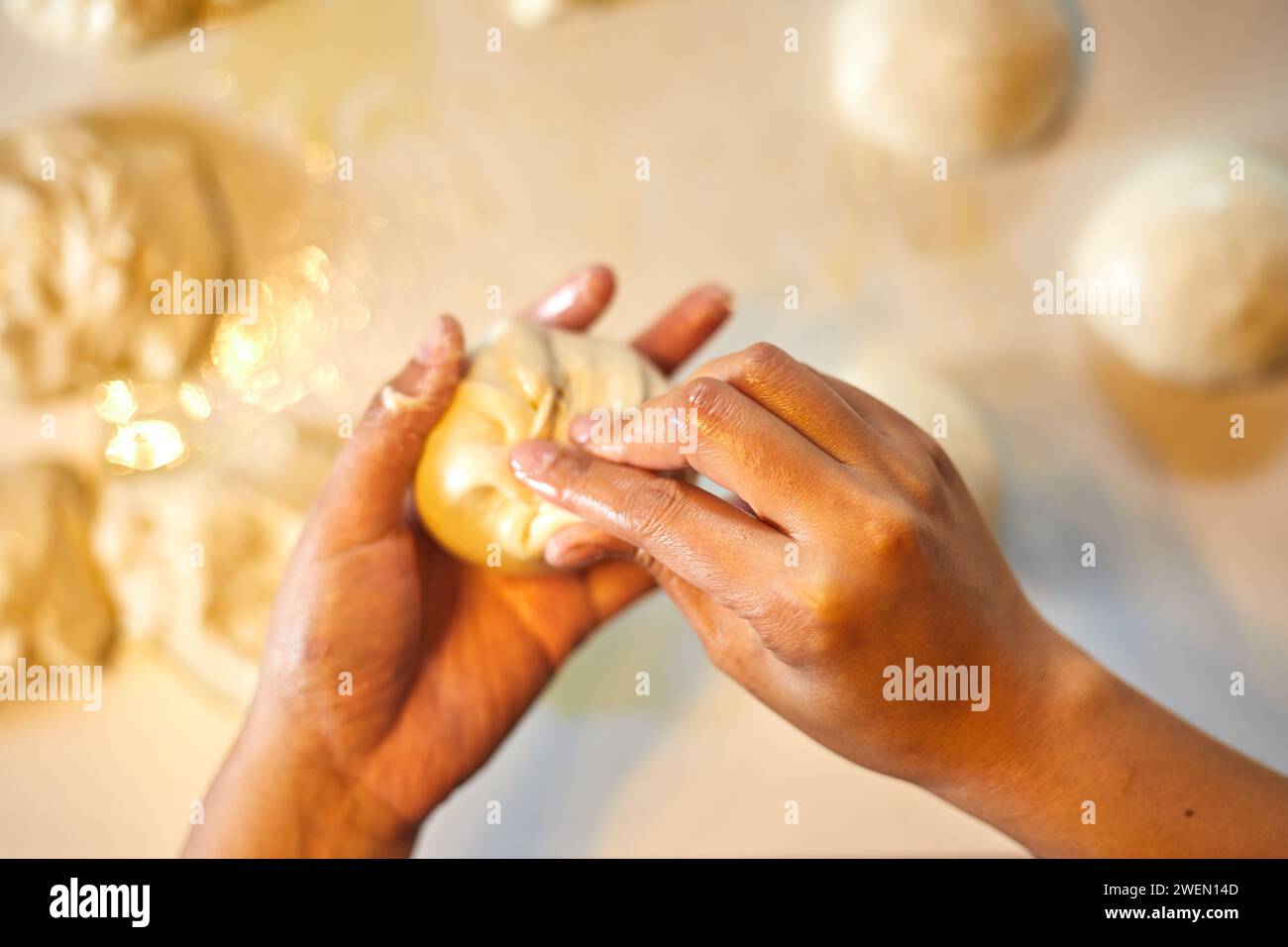 Close up hands preparing dough for pizza Stock Photo