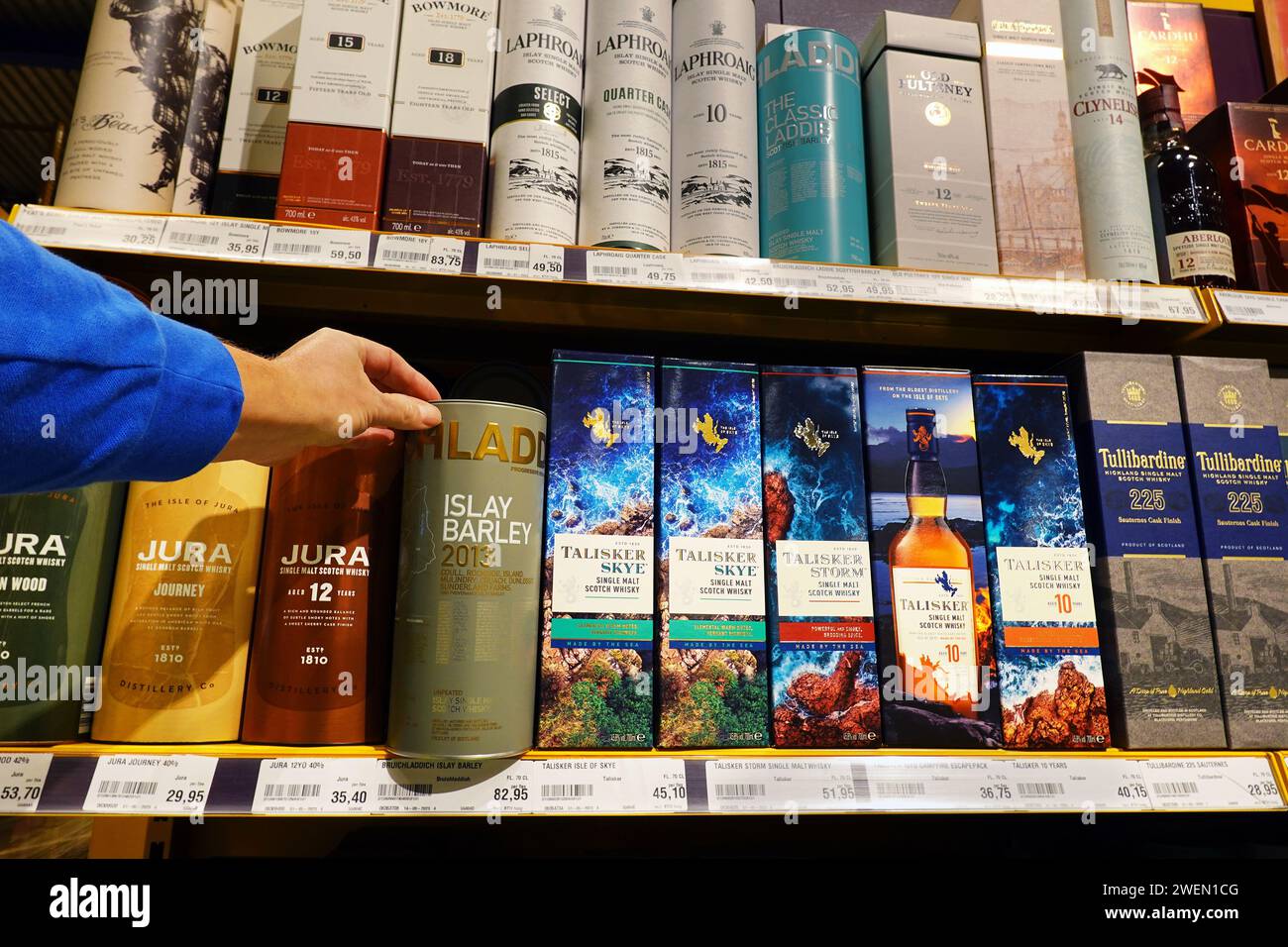 Bottles of whiskey in luxury cardboard packaging Stock Photo