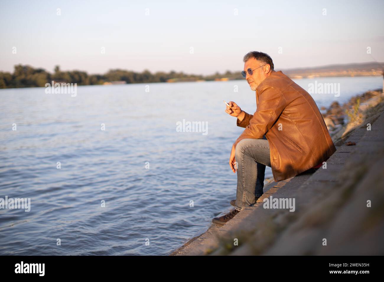 Lonely man sitting on stairs hi-res stock photography and images - Alamy