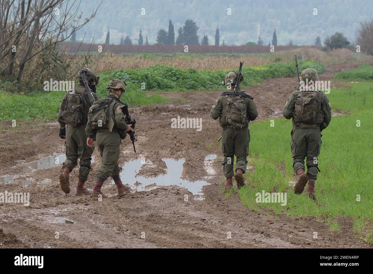 Israeli soldiers search a field after two explosive-laden drones were ...