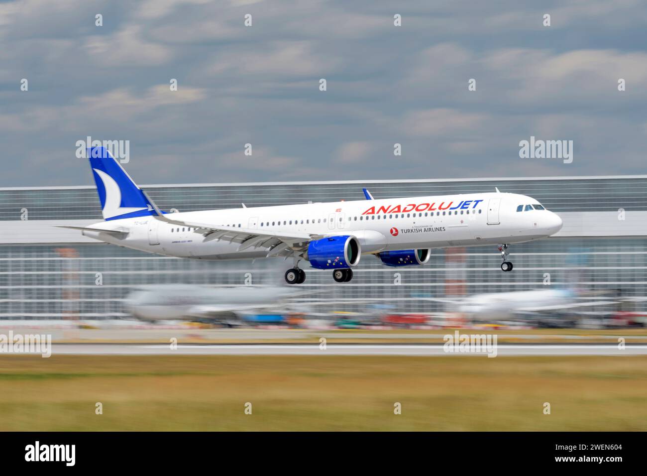 Munich, Germany - July 06. 2023 : AnadoluJet Airbus A321-271NX with the aircraft registration TC-LUE during landing on the southern runway 08R of the Stock Photo