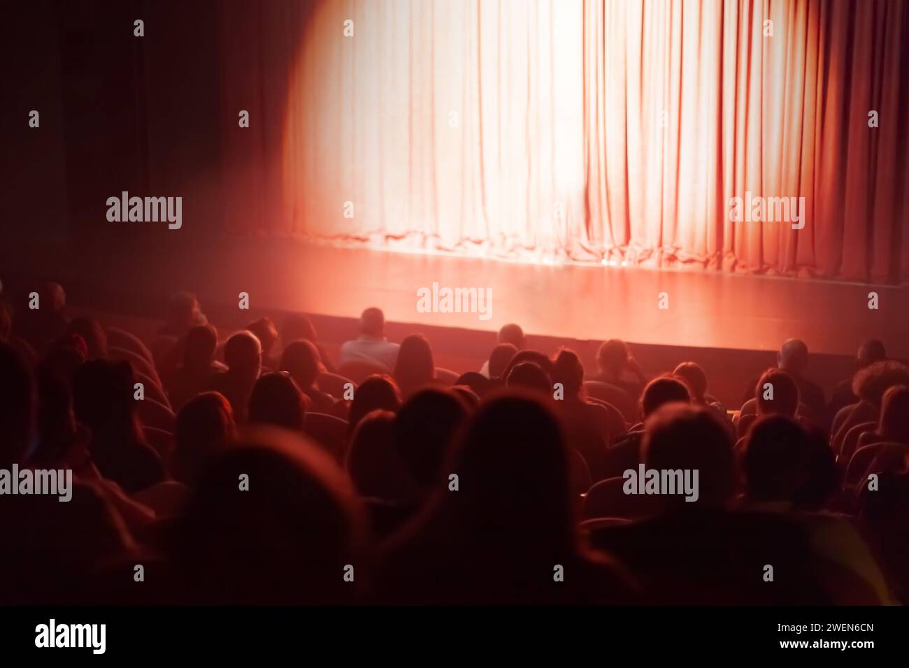 spotlight on red curtains theater stage Stock Photo