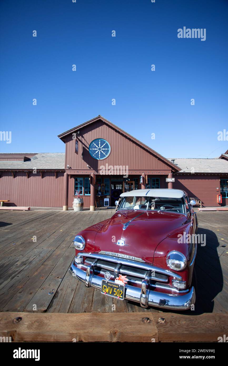 1952 Plymouth Cranbrook 4 Door Sedan along Santa Barbara Pier in California, also known as Stearns Wharf. Stock Photo