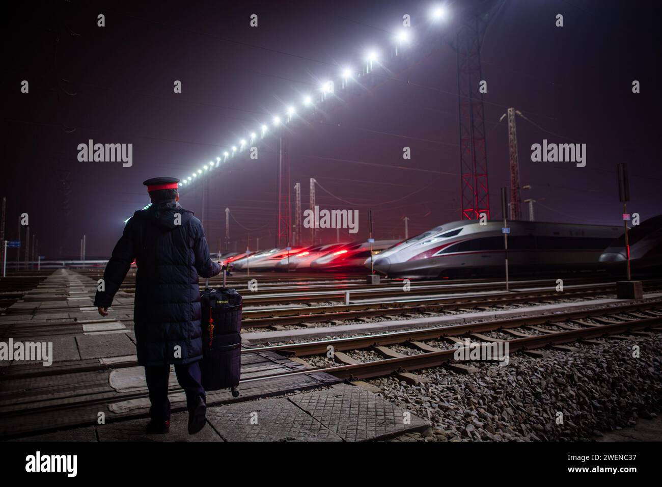 Route Inspection (240126) -- WUHAN, Jan. 26, 2024 (Xinhua) -- Driver Ni Long walks ...