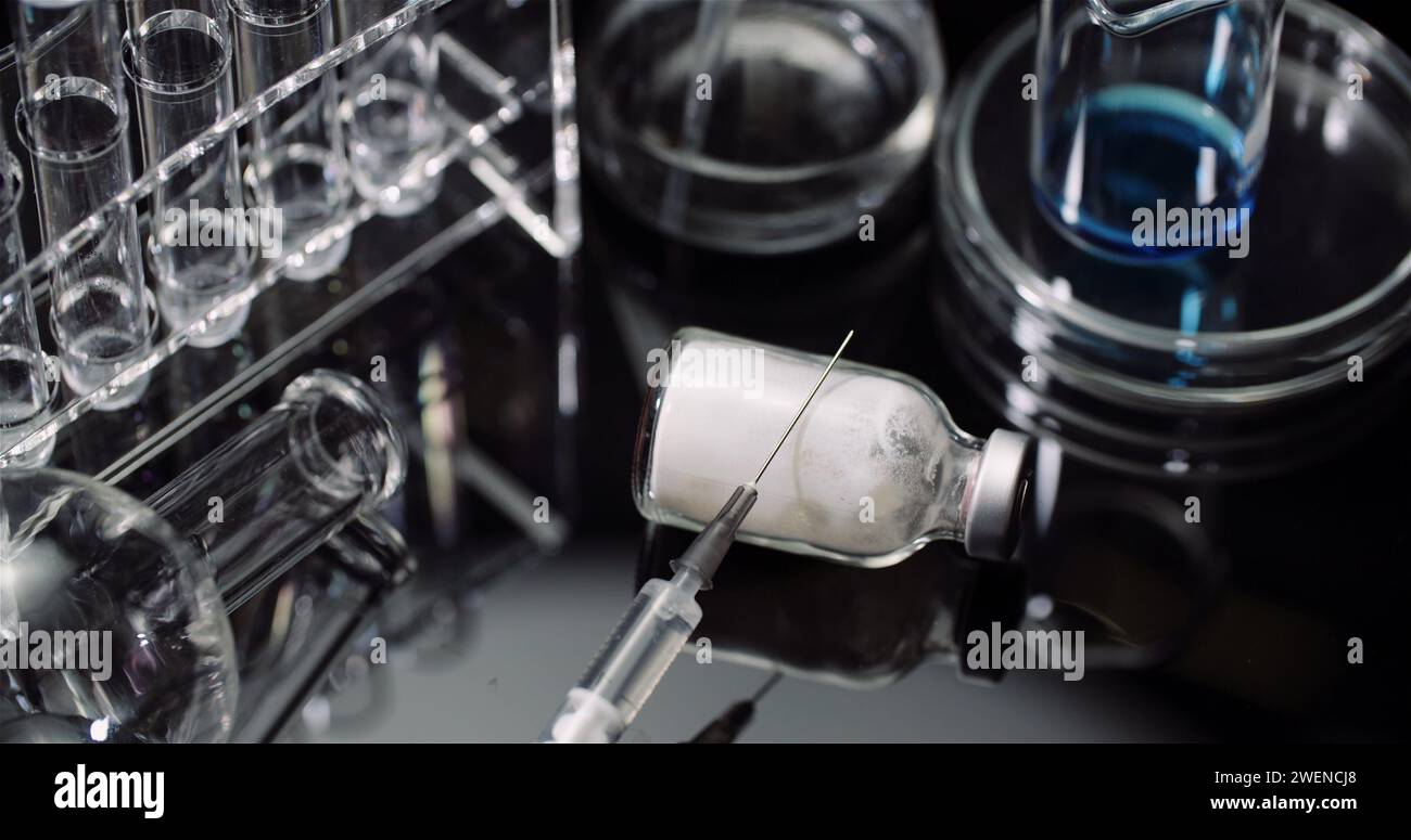 Rotating Syringe Laboratory Equipement: Syringe and Medicine, Test Tubes and Flasks ...
