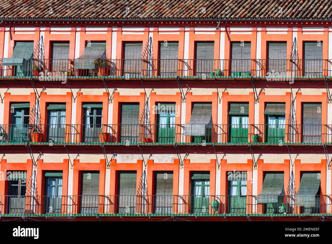 Facade of a building with balconies in Cordoba, Spain 