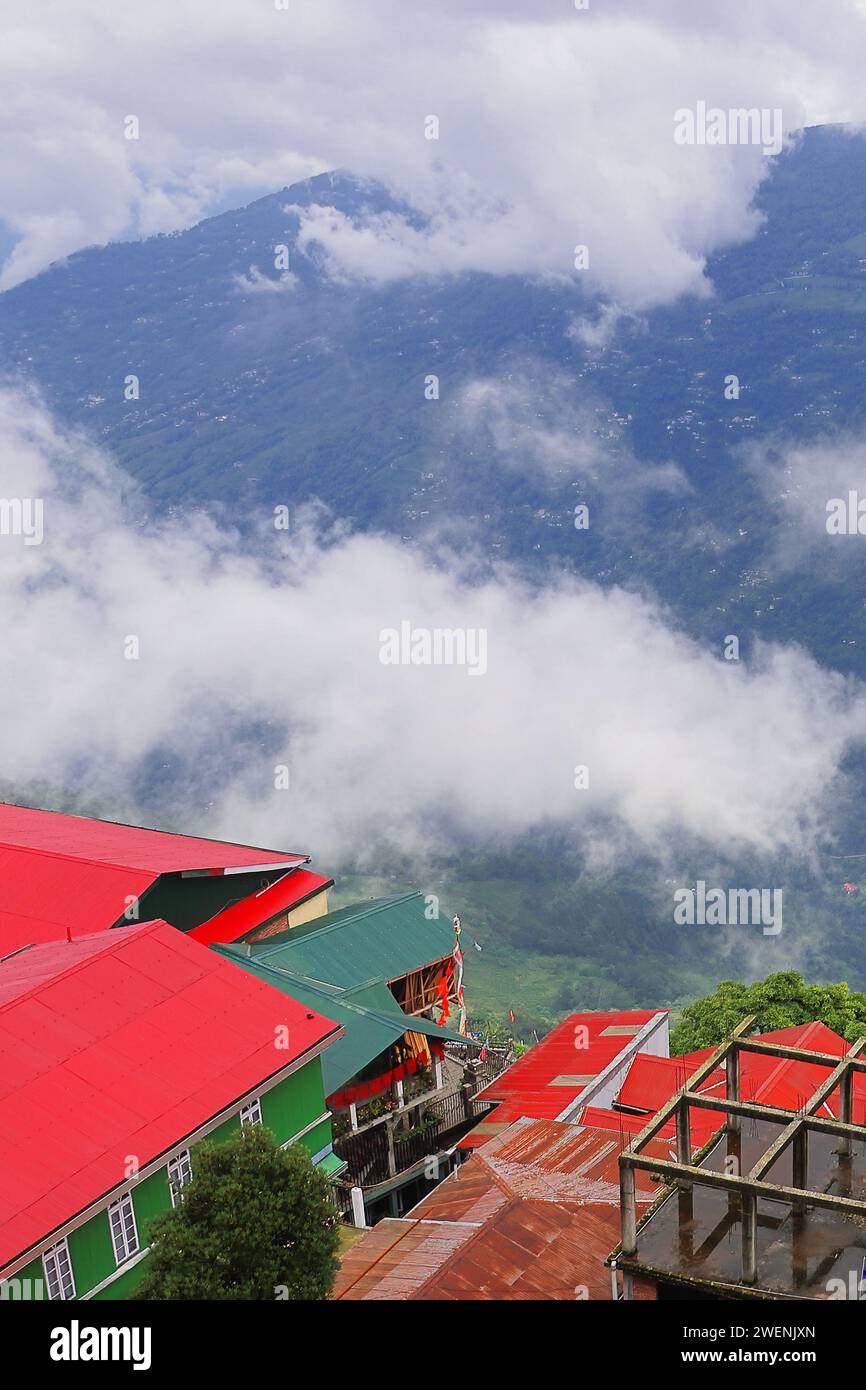 cloudy and misty lush green himalaya mountain foothills and countryside panoramic view near darjeeling hill station in monsoon season, india Stock Photo