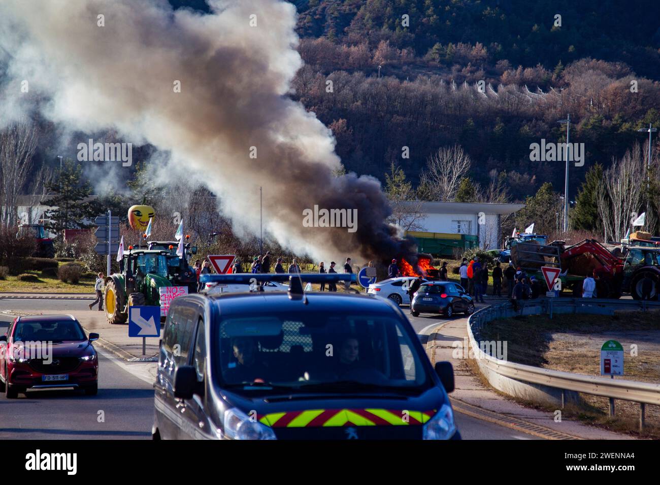 Farmers from Hautes-Alpes block the A51 and the departmental road, they make a fire on the Saulce roundabout, France, Hautes-Alpes, Saulce, on January 25, 2024. Farmers in the Hautes-Alpes are expressing their discontent. This operation is part of the national protest movement of farmers who denounce the increase in charges, the delay in payment of CAP (common agricultural policy) aid and compensation after Avian Influenza, over-administration, excessive standards or even non-compliance with a remunerative price, Photo by Thibaut Durand /ABACAPRESS.COM Stock Photo