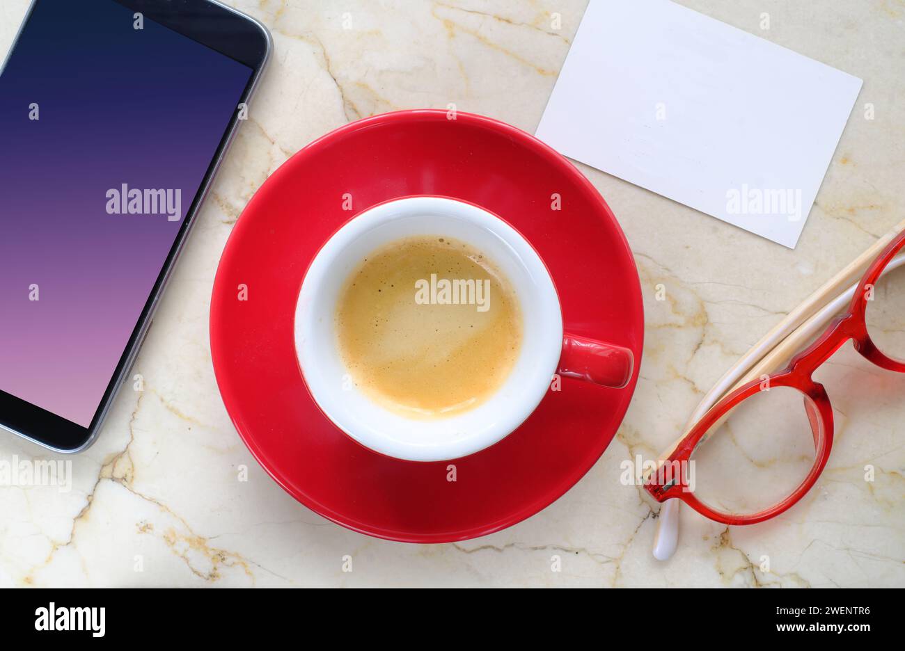 business apiontment, meeting or networking  concept or template, blank business card,cup of coffee smartphone and spectacles. Stock Photo