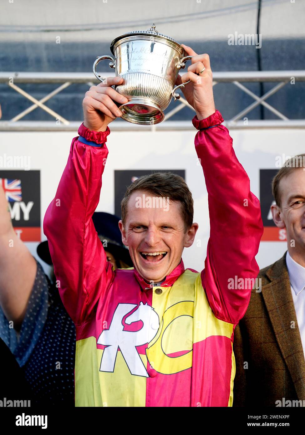 Major Will Kellard celebrates with the trophy after winning the Grand