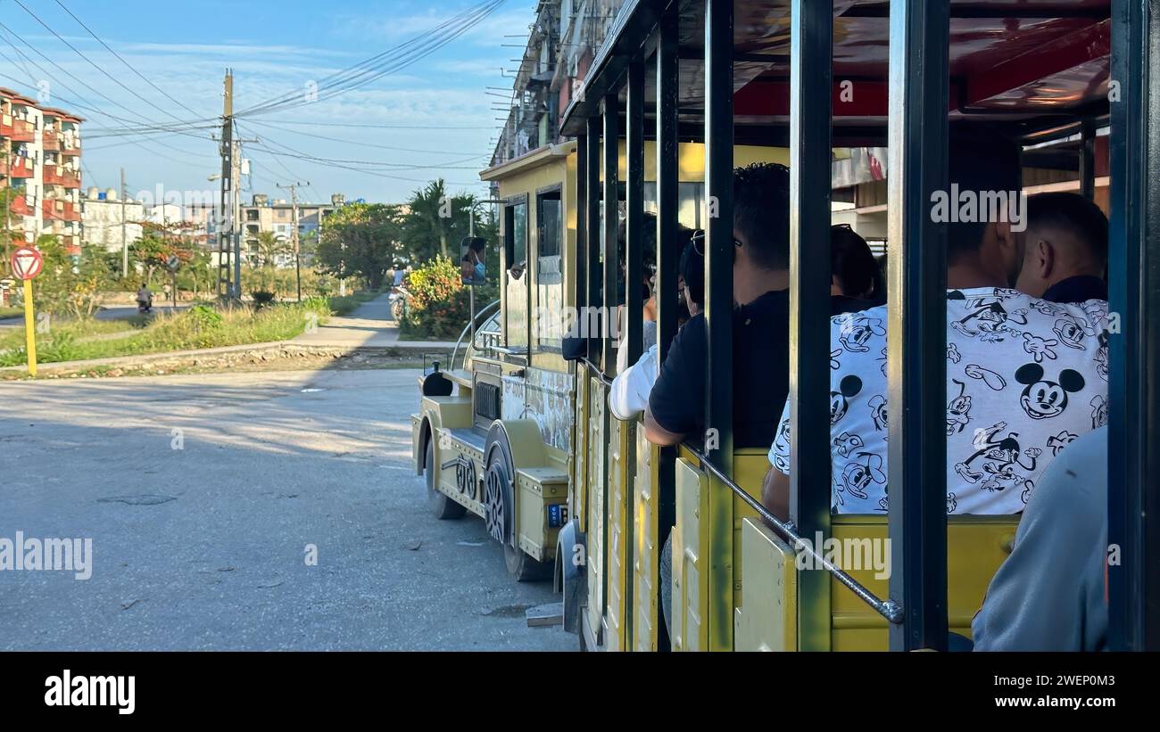 Train-like vehicle transporting passengers in the city in Santa Clara, Cuba Stock Photo