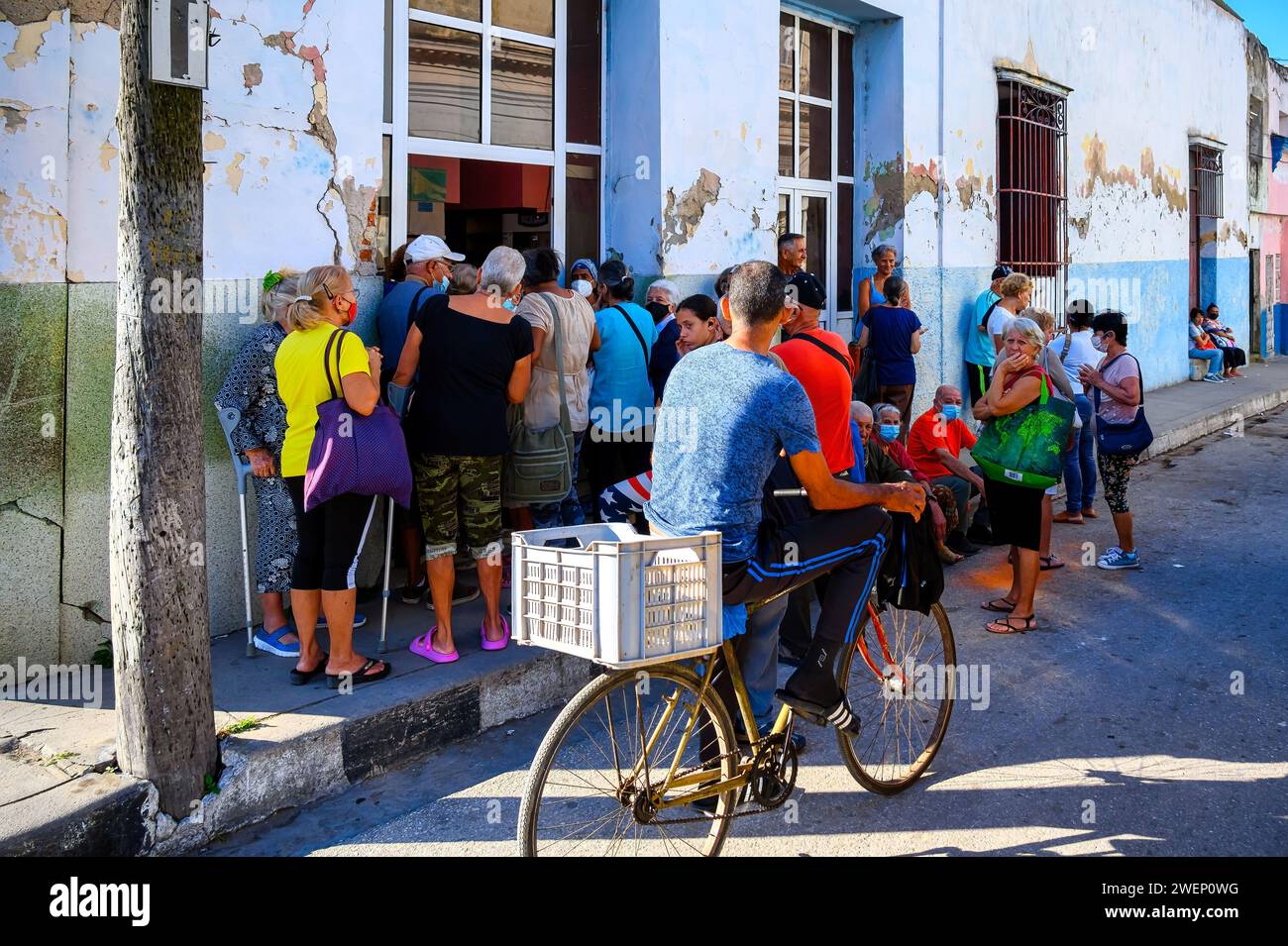 People lining-up or waiting in line to buy medications in a pharmacy in Santa Clara, Cuba Stock Photo