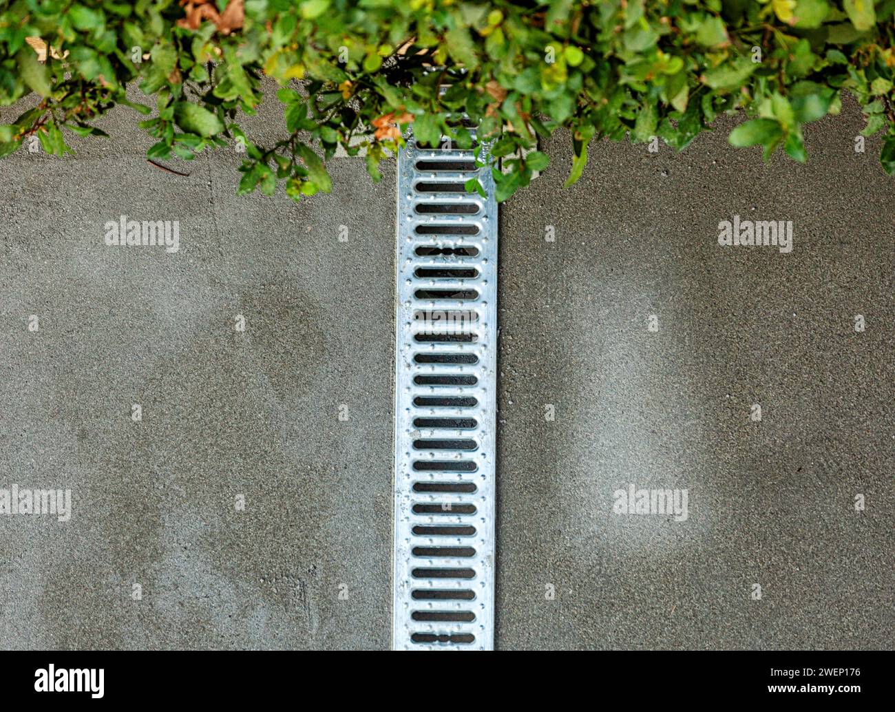 Water drainage grate in the garden during the creation of the screed