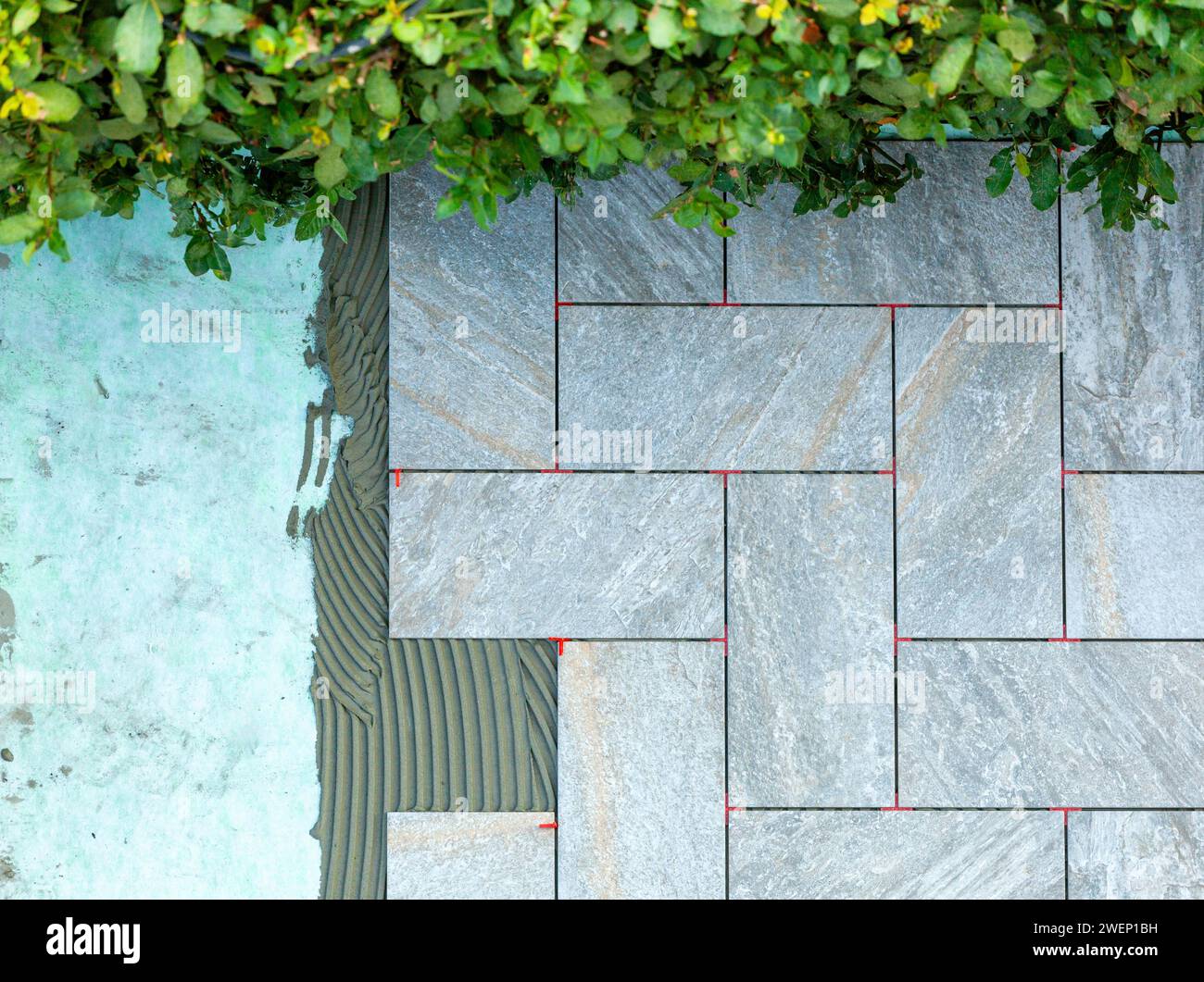 Laying outdoor tiles on a soundabsorbing mat Stock Photo Alamy