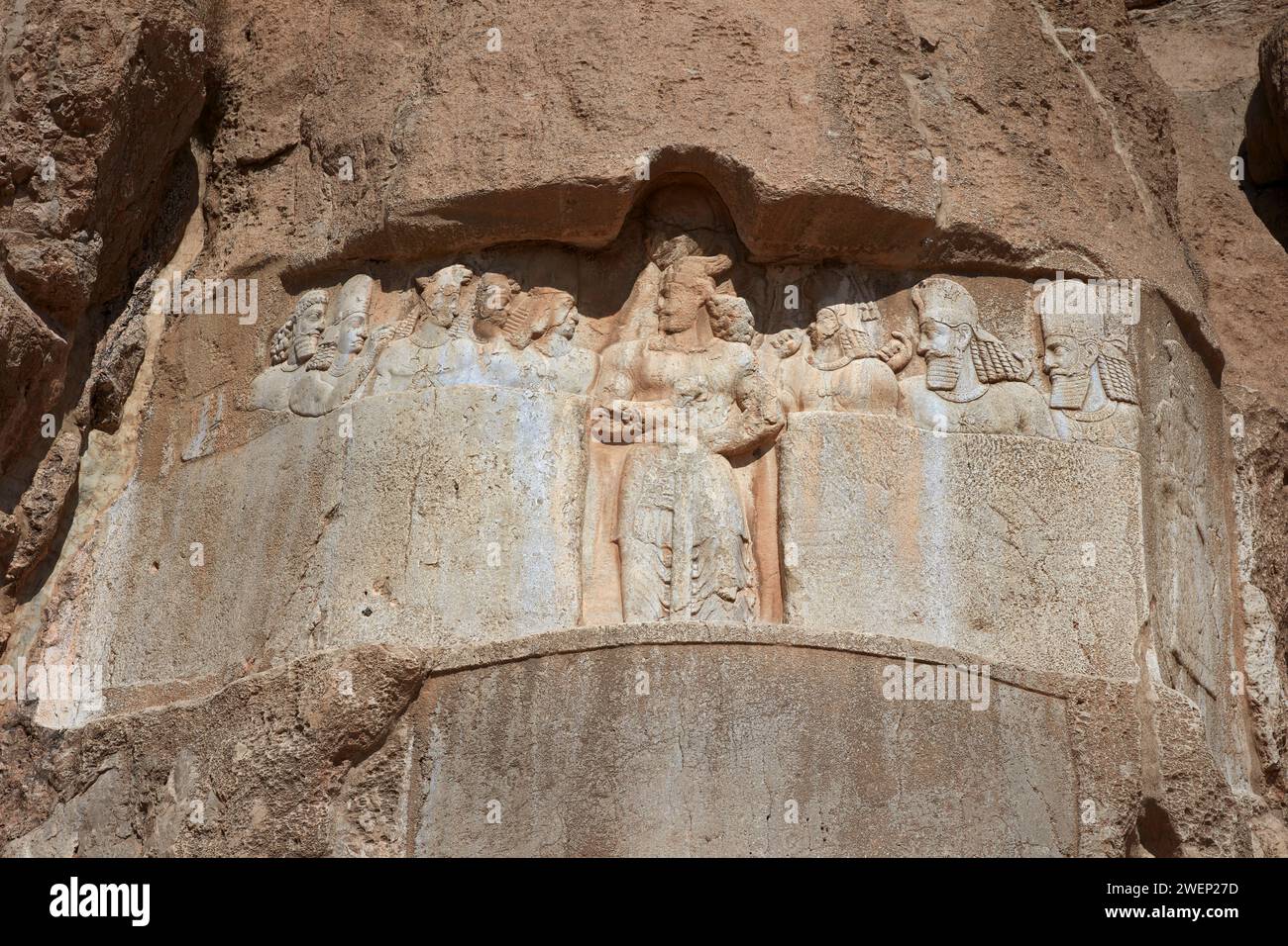 Rock relief of Persian king Bahram II and his royal family carved over Elamites relief dated to the 3rd millennium BC. Naqsh-e Rostam Necropolis, Iran Stock Photo