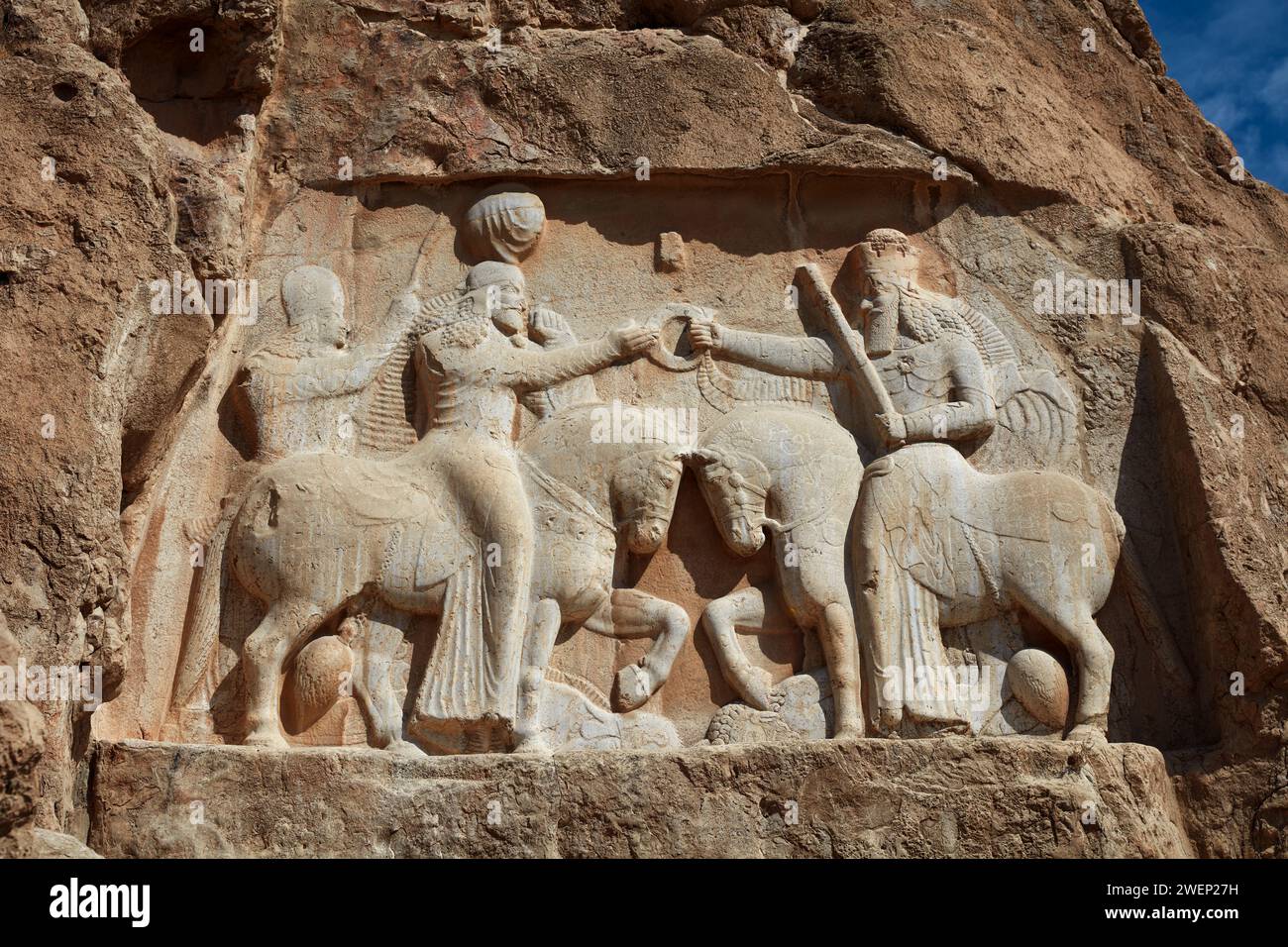 The Investiture of Ardashir I, relief depicts the Persian king Ardashir I receiving the sovereignty ring from god Ahura Mazda. Naqsh-e Rostam, Iran. Stock Photo