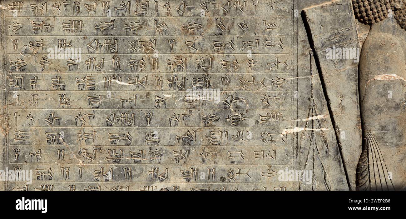 Cuneiform inscriptions in Persepolis, ceremonial capital of the Achaemenid Empire (550–330 BC). Fars Province, Iran. Stock Photo