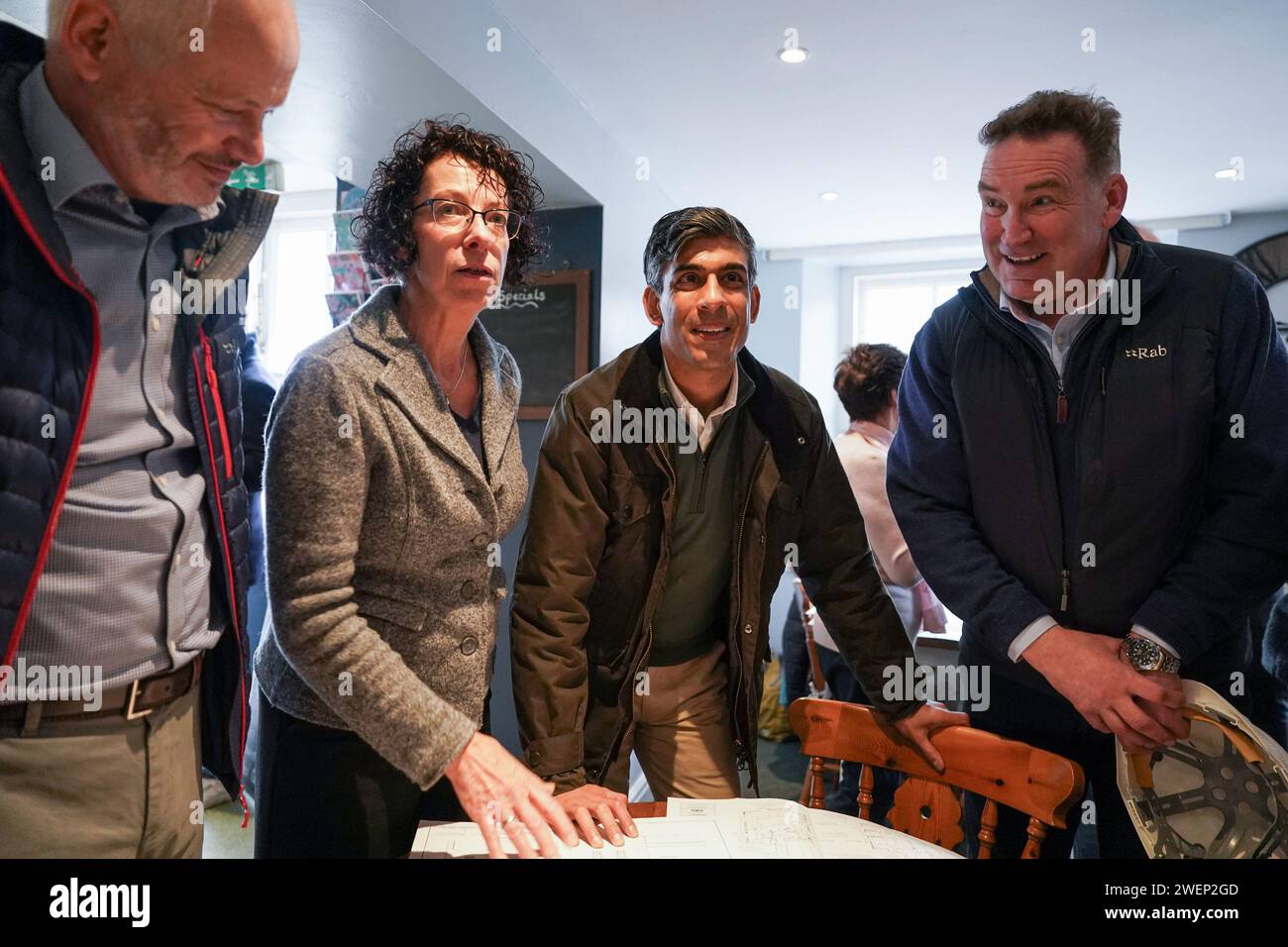 Prime Minister Rishi Sunak looks at building plans as he visits Corn